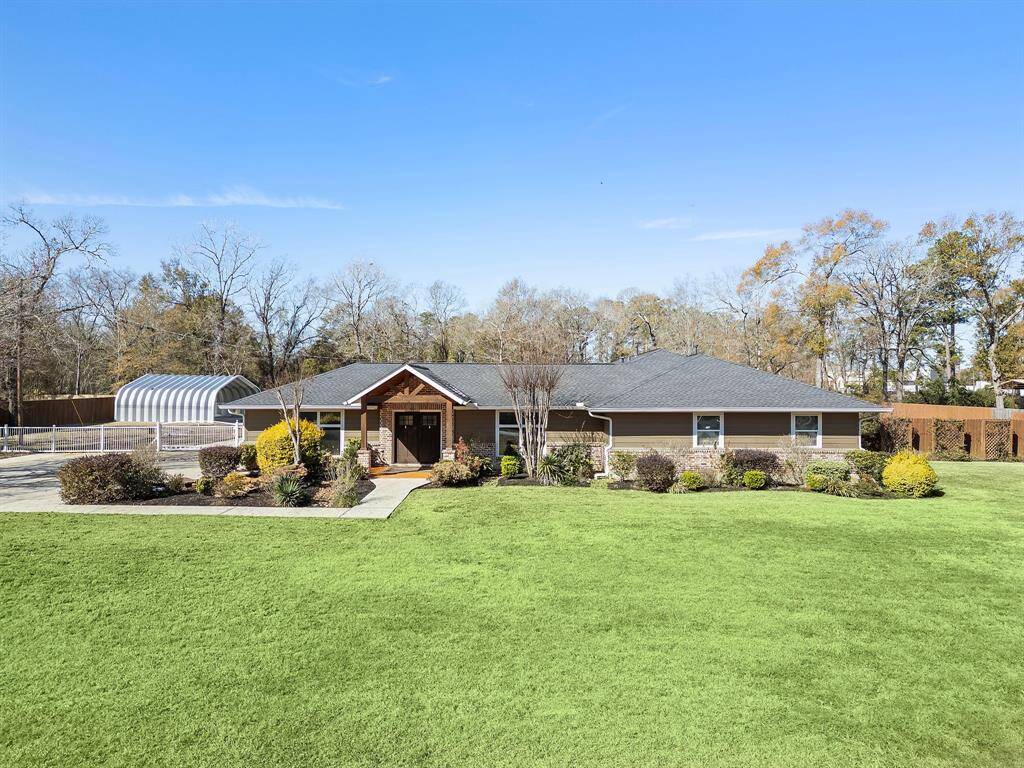 Gorgeous curb appeal with custom landscaping.