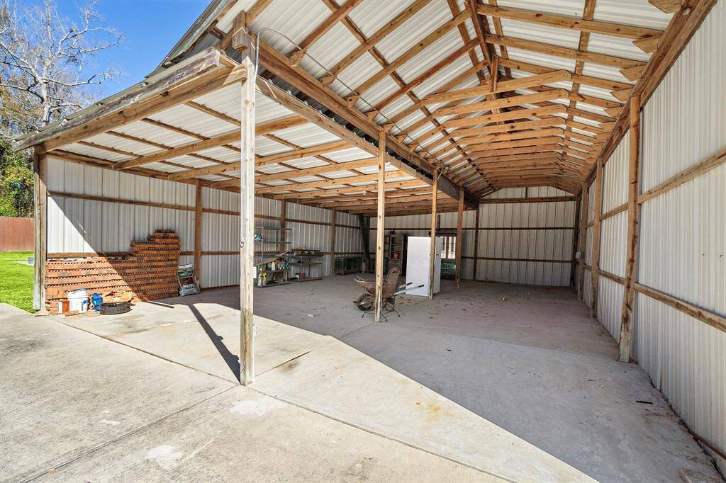 The 3rd outbuilding is tall enought to fit an RV.  (41x29)