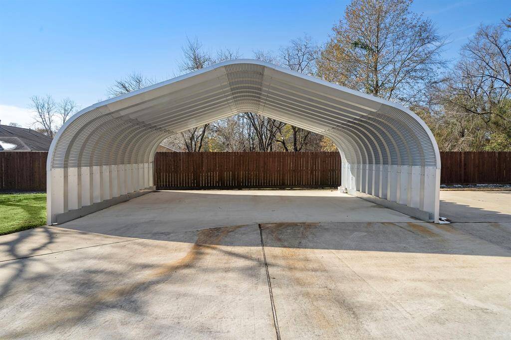 The metal carport is large enough to fit a boat and can withstand 175mph winds. (28x25)
