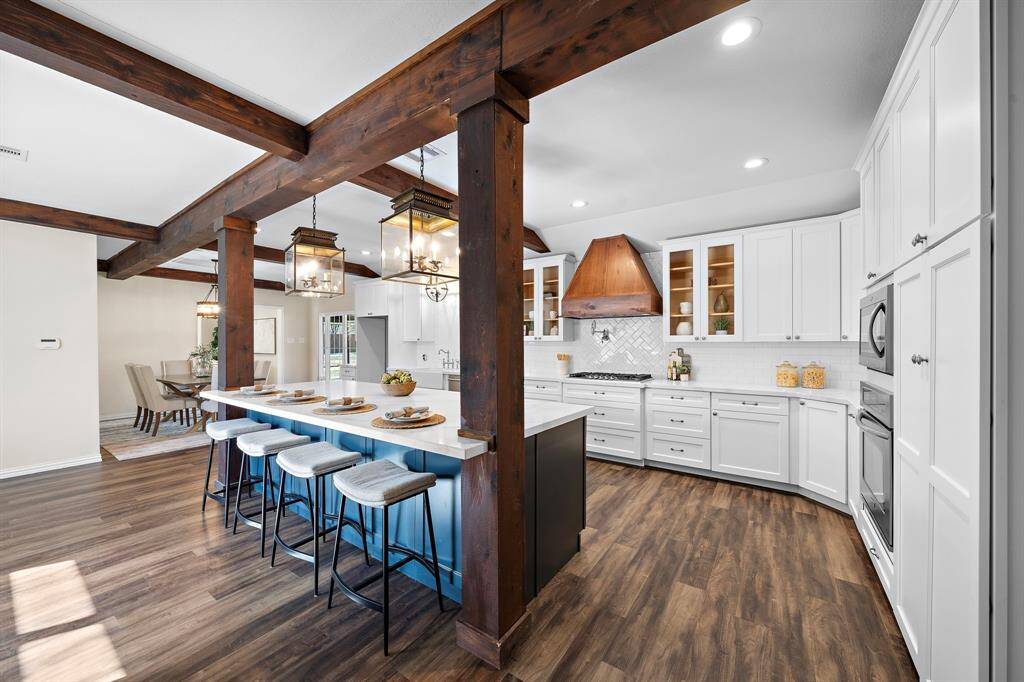 The kitchen features a breakfast bar that is great for extra seating and an island without a cook top, which provides extra counter space.
