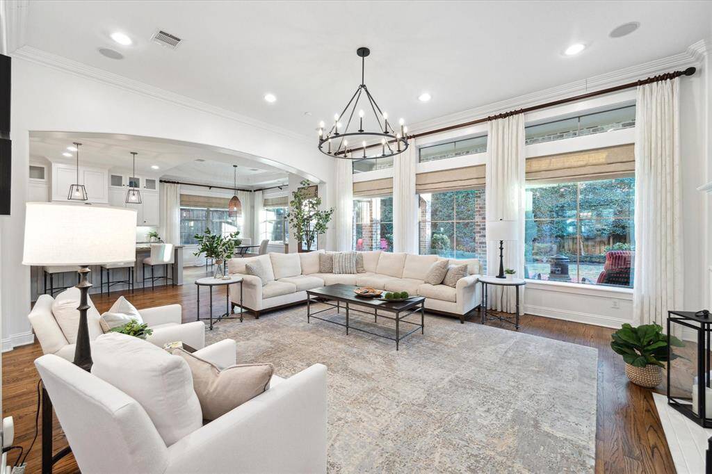 The abundance of natural light highlights the flow and tranquility of the formal living room.