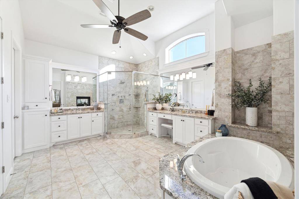 The primary spa is complete with multiple shower heads and a jetted tub for relaxation.
