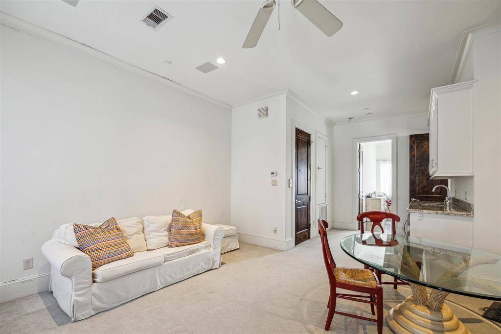 The fourth floor offers a bedroom and full bath with game room and wet bar.  This is the perfect space for someone who wants their own space!