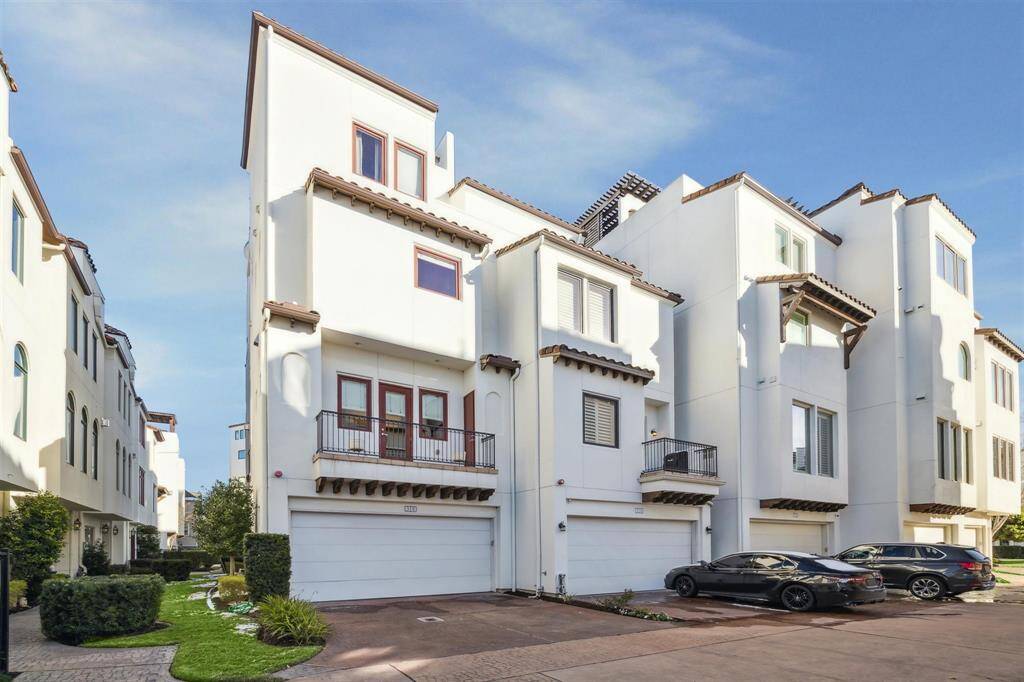 The embossed concrete space behind the two-car garage provides room for two more vehicles. This is rare to have parking for four vehicles in a gated community.