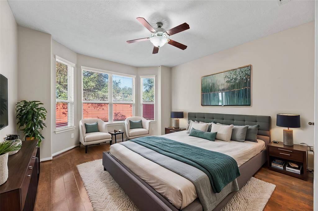 Welcome to your oversized primary retreat! With a wall of windows, beautiful flooring, neutral paint tones, and a spa-like ensuite primary bath, you may never want to leave! Created for comfort, step inside and start dreaming.