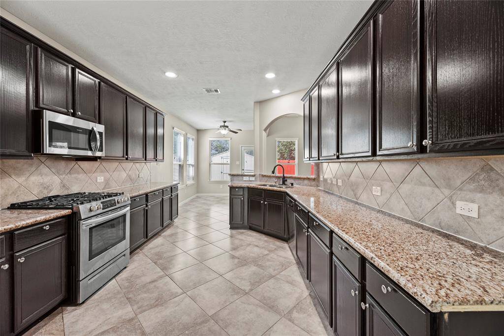 Another look at the kitchen and how it opens up to the family room, the breakfast room and offers direct access to the dining room for all your entertaining needs!