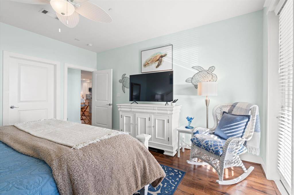 This primary has access to the balcony and extra seating area. All tv's and electronics stay.