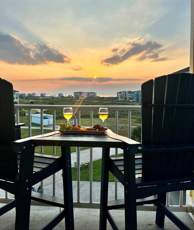 Spectacular sunset views of the bay from the second balcony off the bonus room.