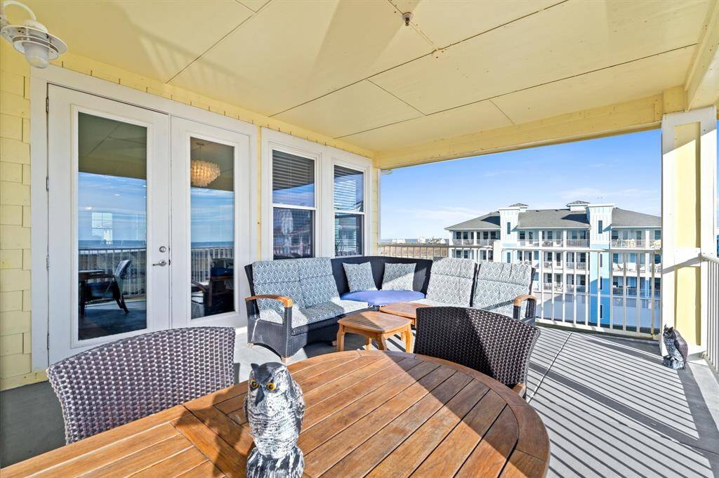 This large covered balcony with ocean views will be the perfect spot to enjoy time with family and friends!