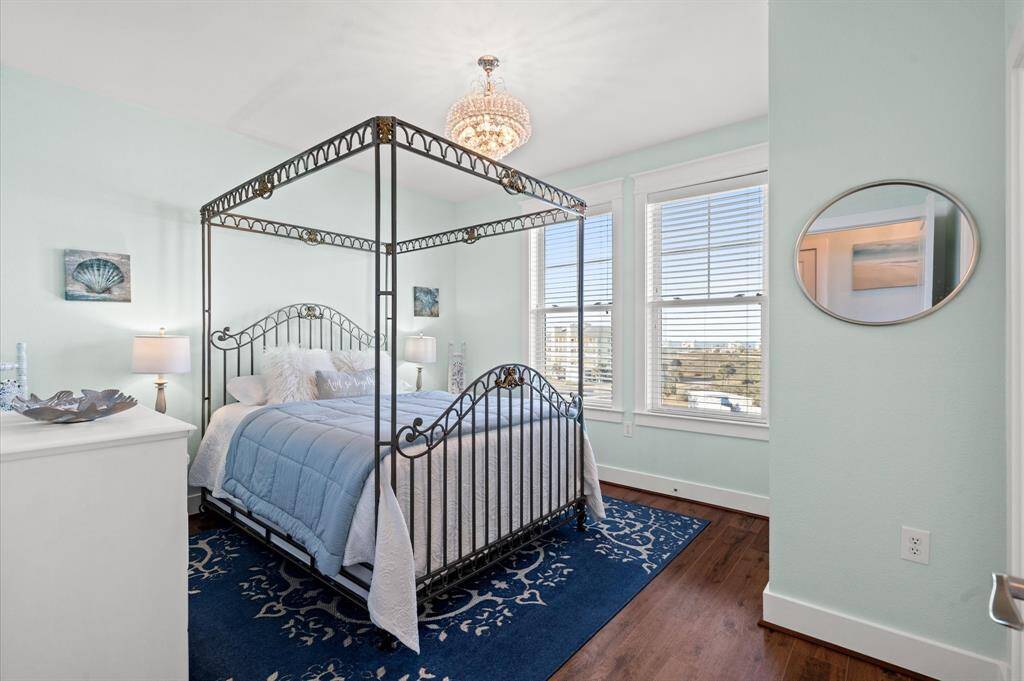 Glam guest room with chandelier and en suite bathroom! NO carpet in the entire villa condo!
