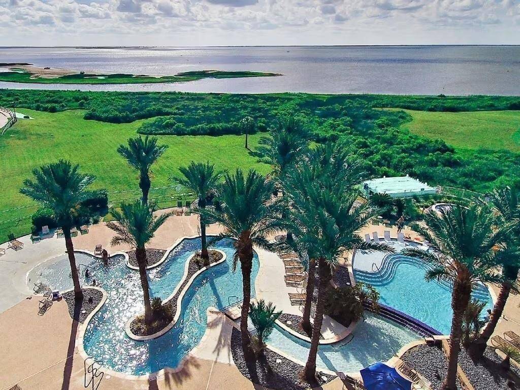 Lazy River on the bay side has a fire pit and hot tub with views of Galvston Bay!