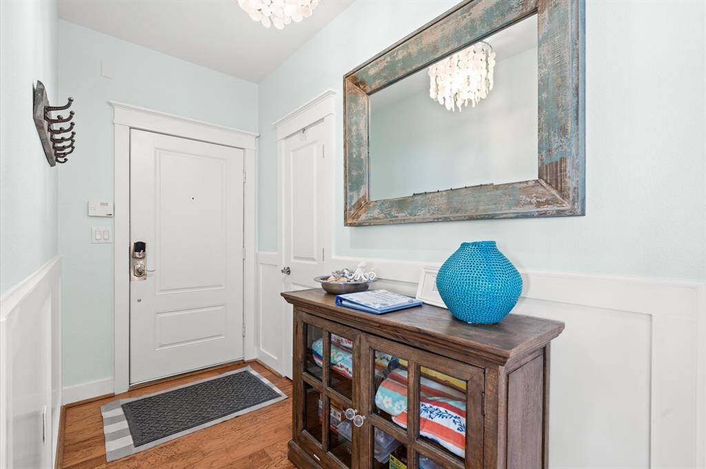 A NEW elevator brings you to this gracious top floor villa. Welcome inside the foyer with a seashell chandelier overhead, beachy chic furnishings and light blue designer paint!