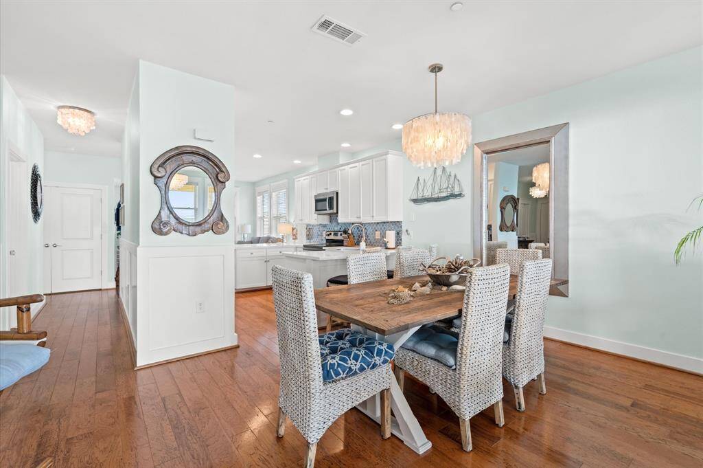 Low maintenance flooring throughout, ALL NEW light fixtures including this seashell dining chandelier.