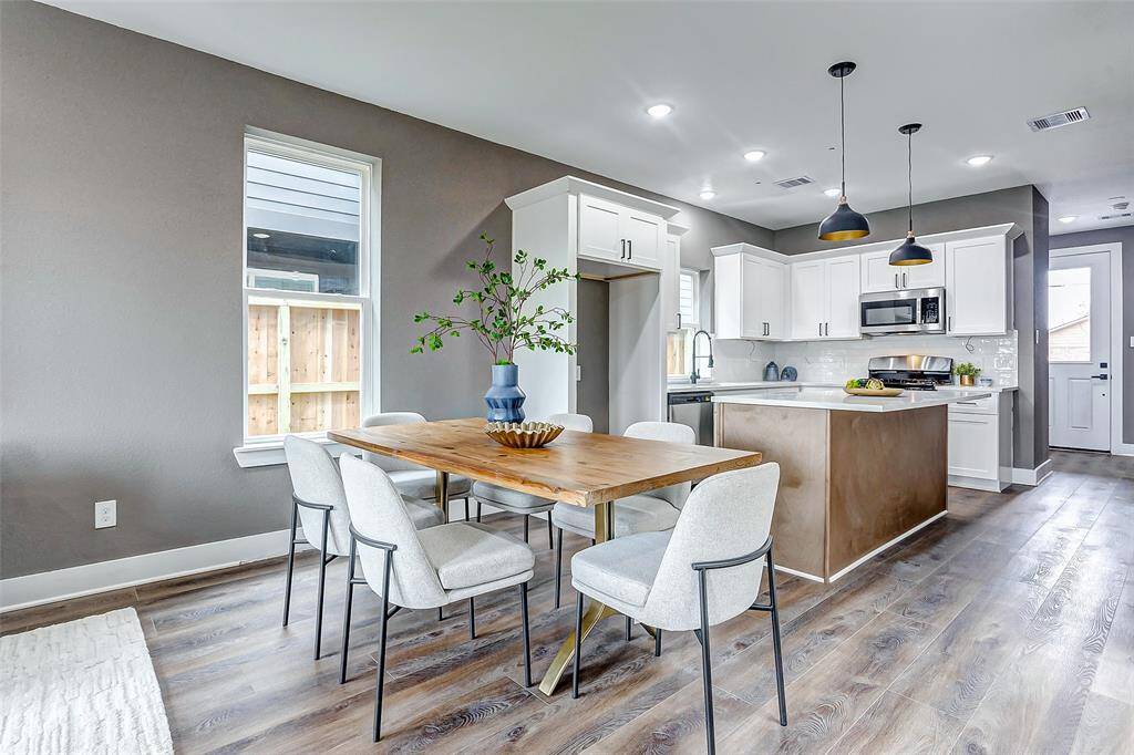 The kitchen flows seamlessly into the dining area, perfect for easy serving and entertaining.
