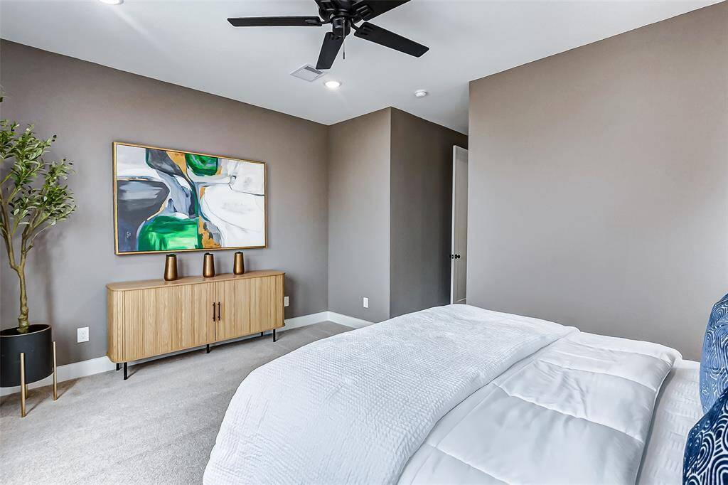 This spacious master bedroom offers ample room for personalization and a dresser.