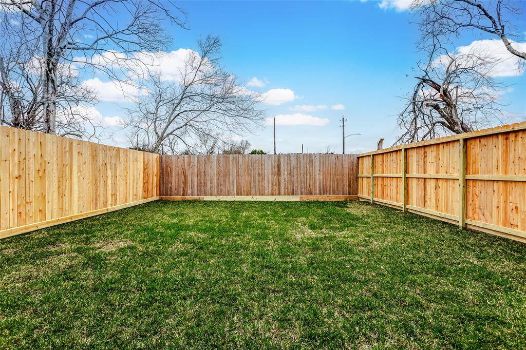 Expansive backyard, ideal for a playground or a vibrant garden oasis.