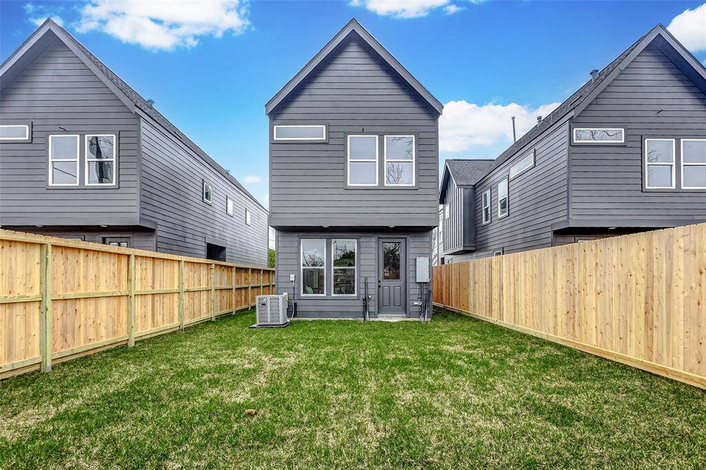 Charming home with a spacious backyard view.