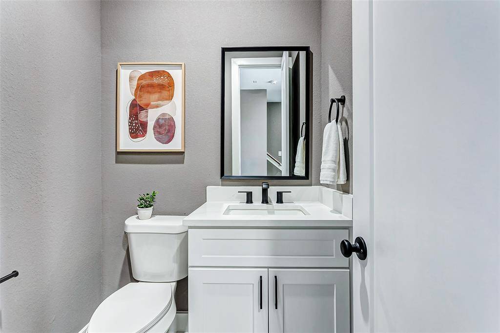 Chic guest bathroom with sleek crisp white accents.