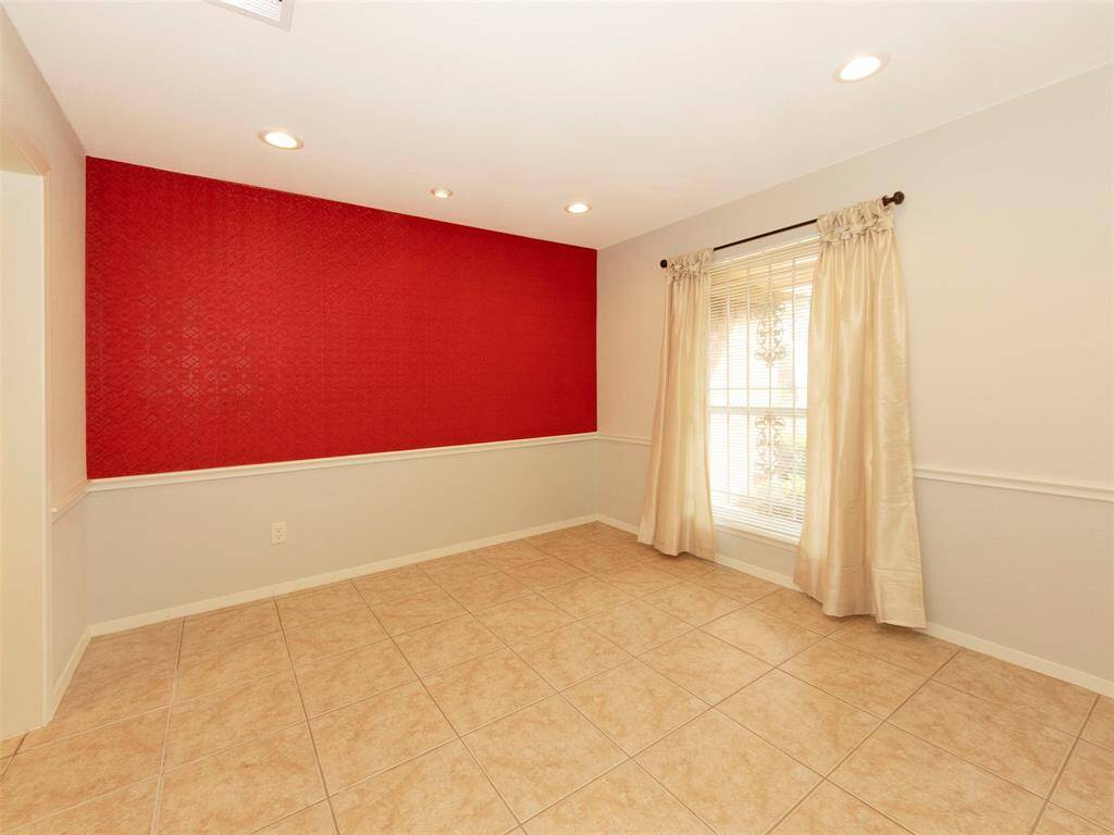 Alternate view of the dining room with accent wall