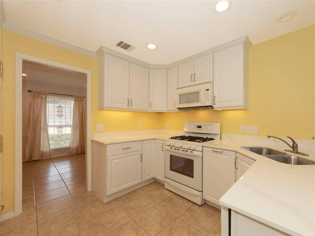 New cabinets and new quartz counters is sure to delight the cook in the family