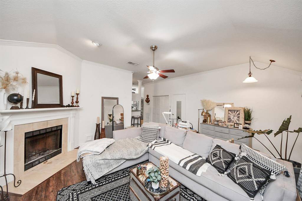 At the heart of the space, a fireplaceadds a cozy focal point, providingwarmth and charm.