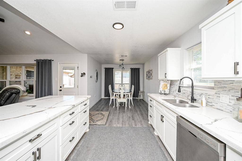 The kitchen and dining areas are seamlessly connected.