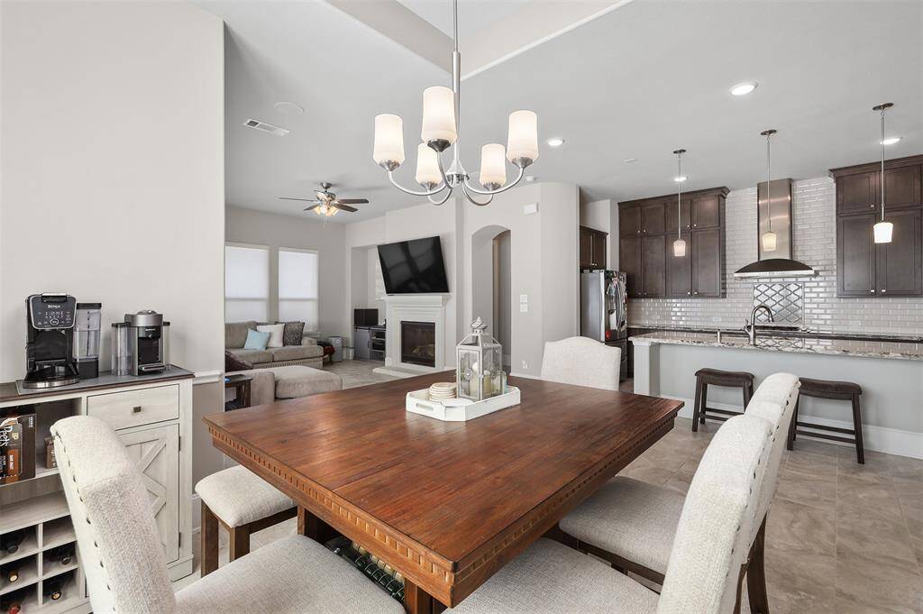 The dining room flows into the rest of the home and is the perfect place to host a full family meal or a morning cup of coffee.