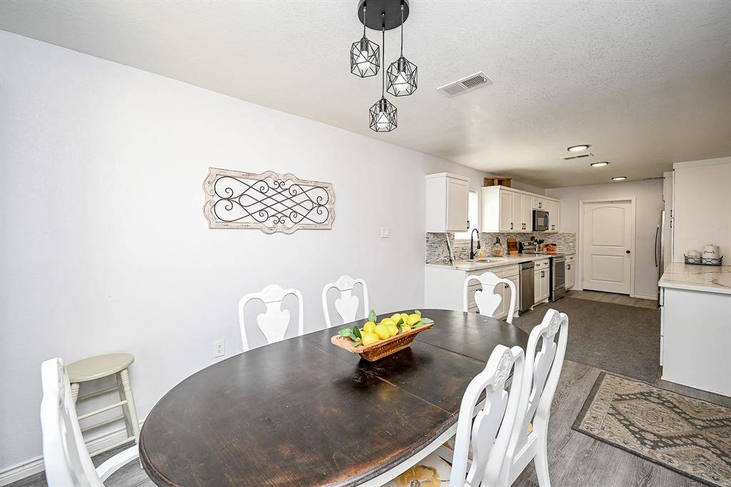 The kitchen and dining areas are seamlessly connected.