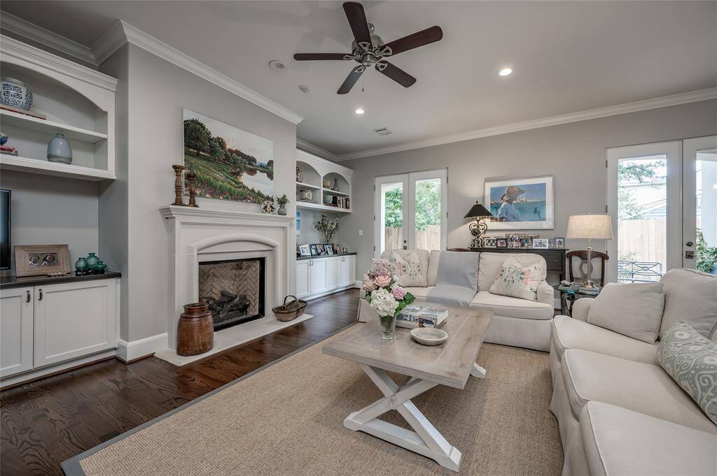 Alternate view of den and sets of double French doors to the backyard
