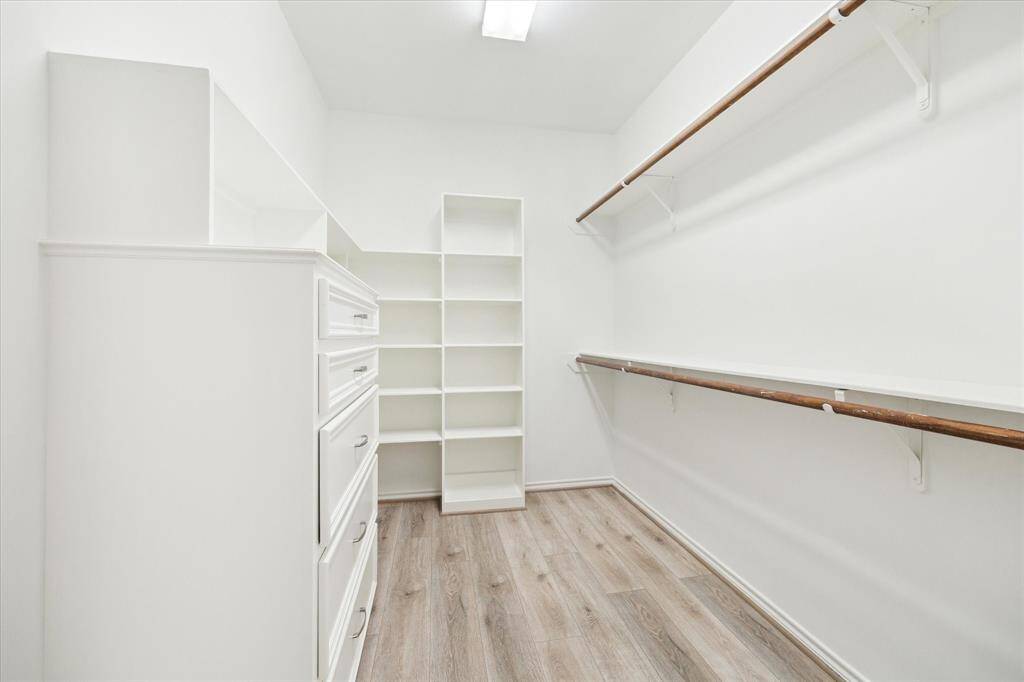 One of the two walk-in closets for the priumary bedroom.