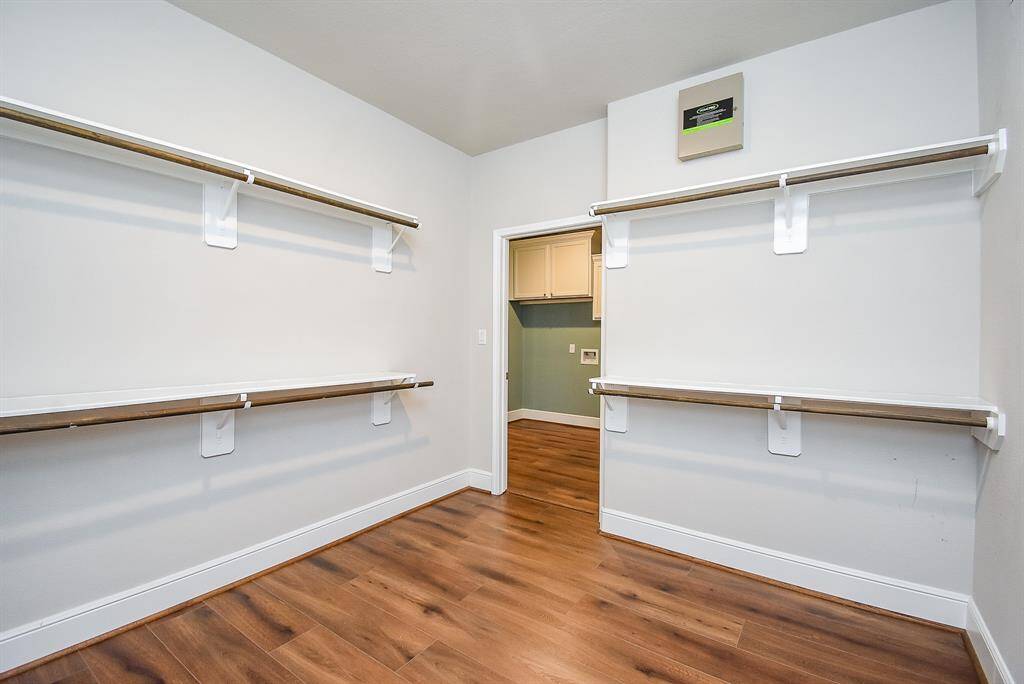 Seamlessly transition from luxury to convenience with the walk-through primary closet connecting the ensuite bath to the laundry area.