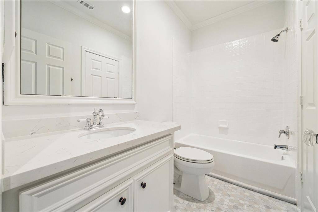 Secondary bath with tub / shower, updated vanity.