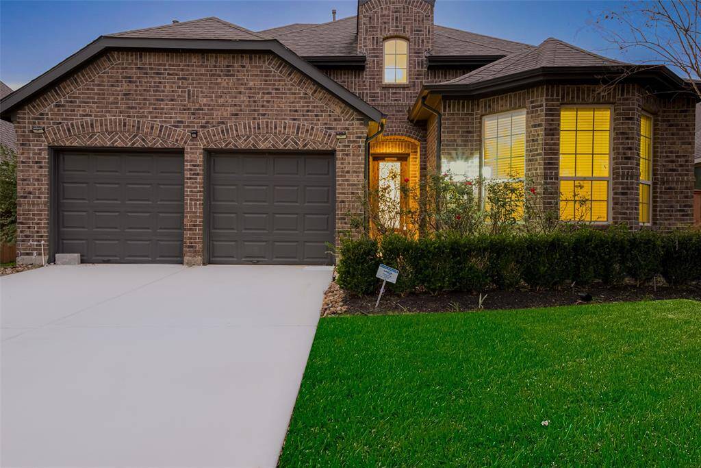 Welcome to this beautiful home in Aliana! Built by Highland Homes, this stunning property features 4 bedrooms (two downstairs) and 3 full bathrooms. The exterior boasts a lovely brick elevation with a porch entryway leading you to a elegant wood and glass front door.