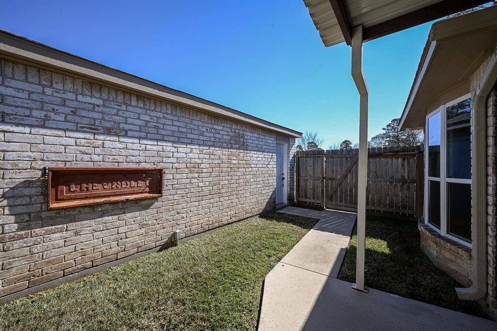 This covered walkway protects you from the rain when making your way to and from your spacious detached garage.