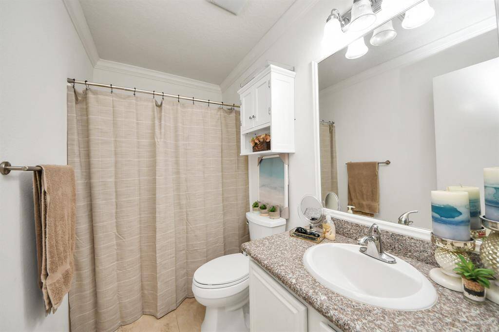 Secondary bathroom features atub/shower combo and vanitywith plenty of counter space.