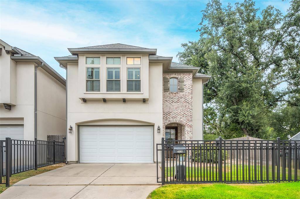 Front elevation of 7416 Shadyvilla Lane. Note the green space that leads to side yard and to back patio & porch. Plenty of space for kids, pets, and al-fresco dining!