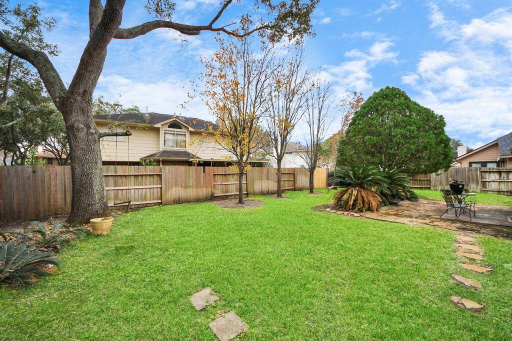 There is plenty of green space in the yard.