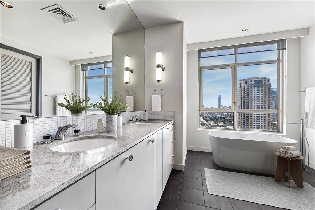 Bathroom shown virtually staged to show the possibilities after some updating.