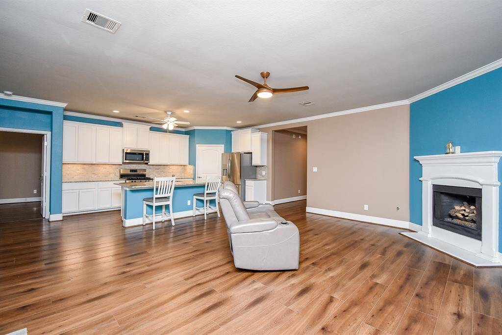 Discover a relaxing haven with an open floor plan, cozy gas fireplace and custom finishes including crown molding through-out.