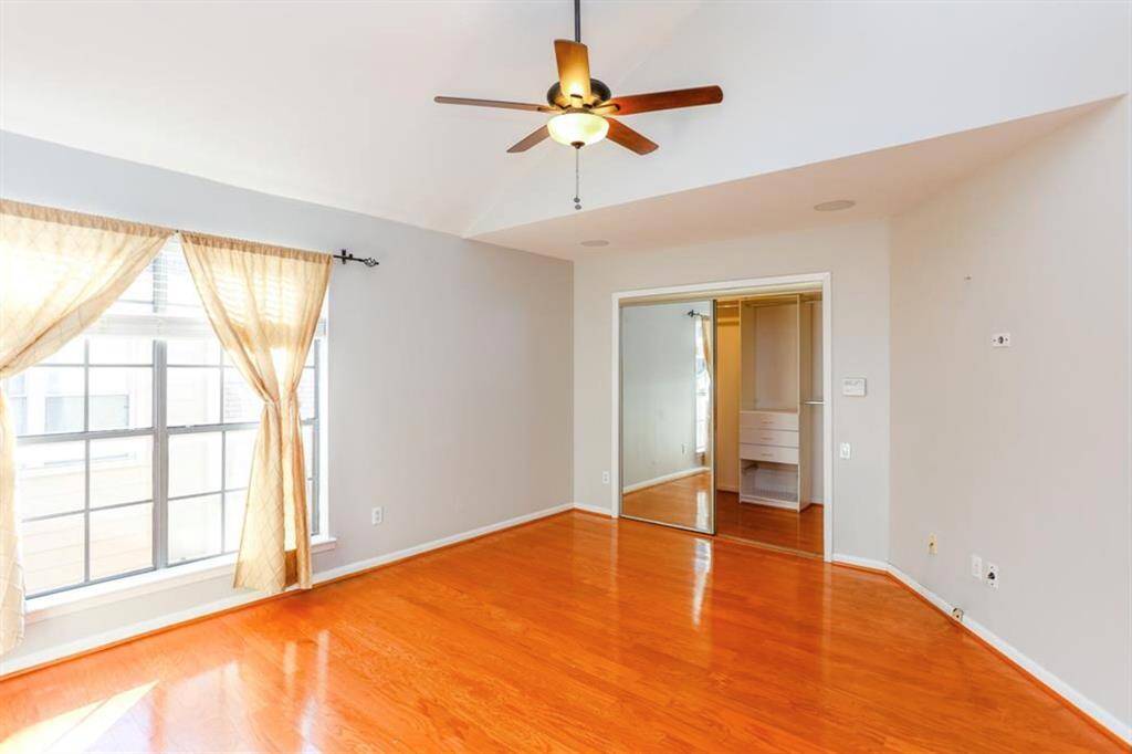 Primary Bedroom on 2nd floor - wood floors and high ceilings