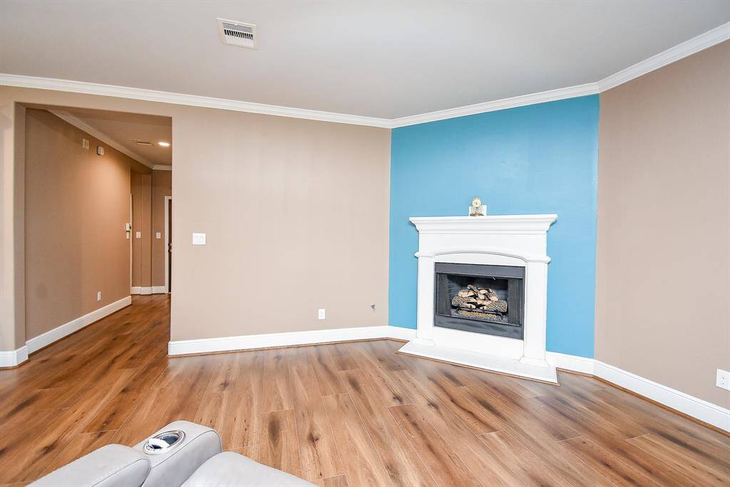 Elevate your living experience with the warmth and ambiance of an elegant gas fireplace, a charming centerpiece in this home's inviting living space.