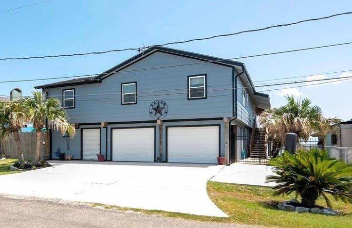 Waterfront gem with spacious 2-car and golf cart garages.