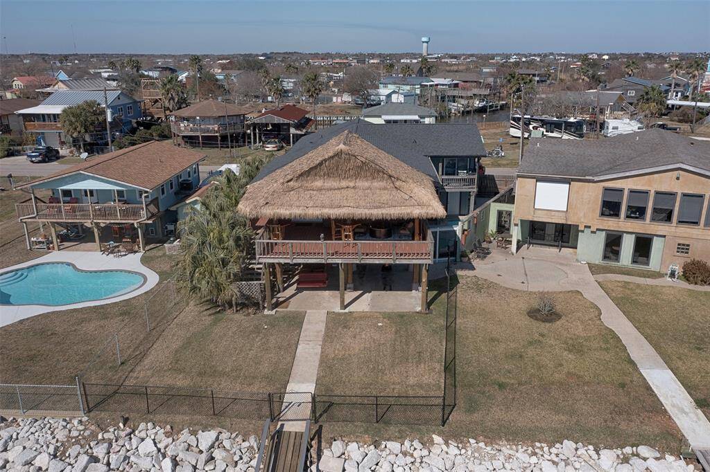 Experience waterfront living with this stunning property, featuring a fully fenced yard and exceptional outdoor entertaining spaces.