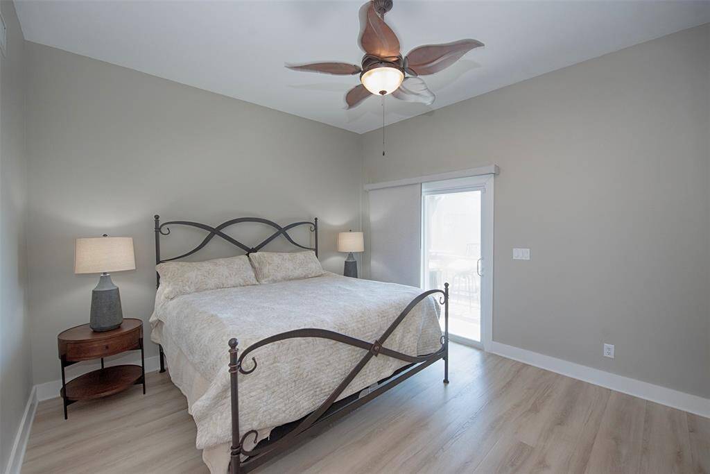 Experience the inviting primary suite with balcony access, complete with privacy blinds to ensure restful mornings.