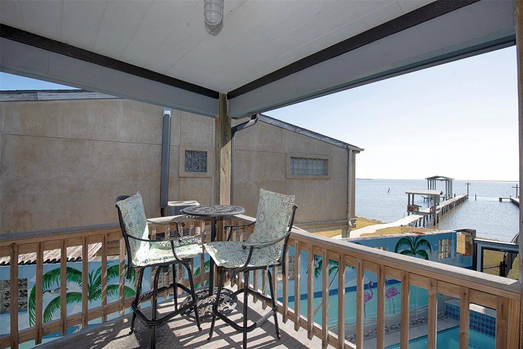 Private balcony off the primary suite with stunning water views.