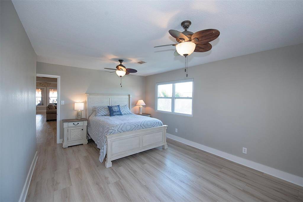 Spacious guest room with ample natural light.