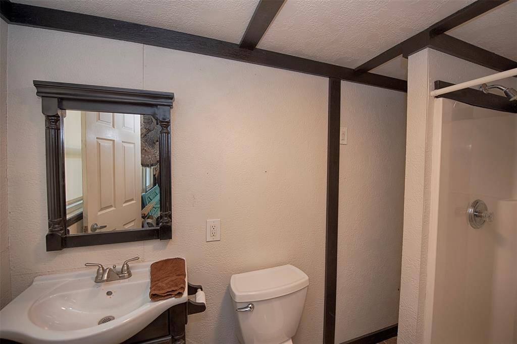 Bathroom features a walk in shower.