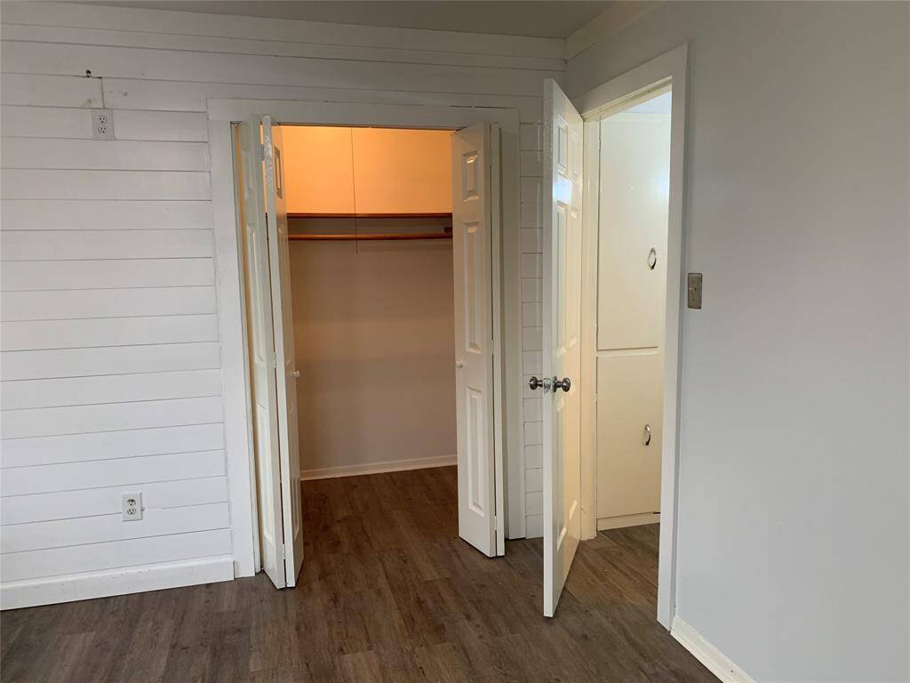 Walk in closet in primary bedroom
