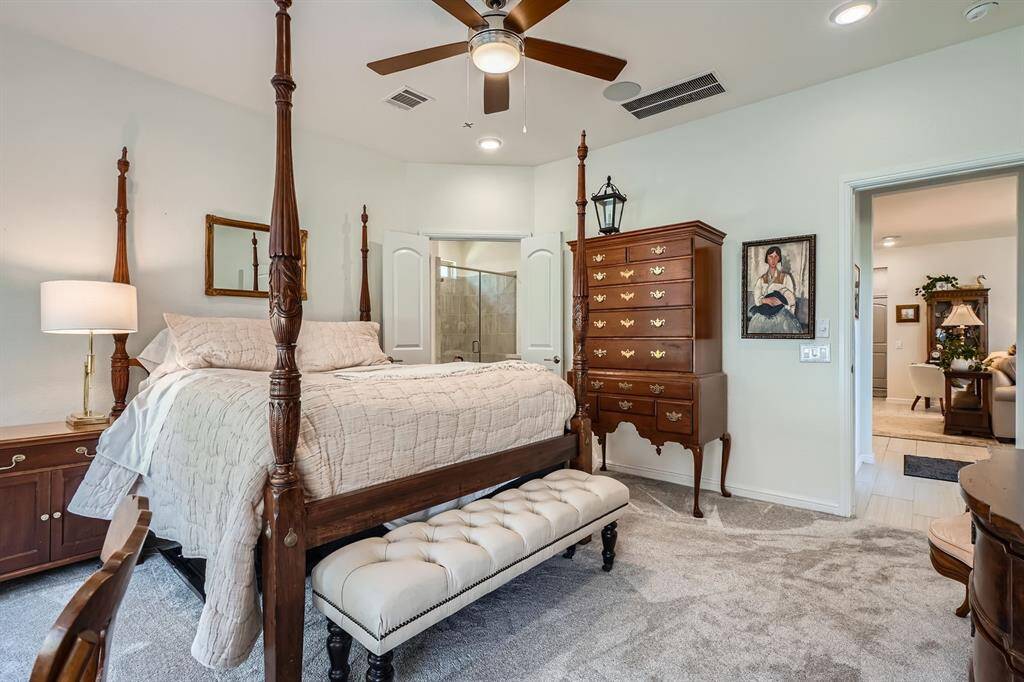 Expansive primary bedroom with ample room for versatile furniture arrangements