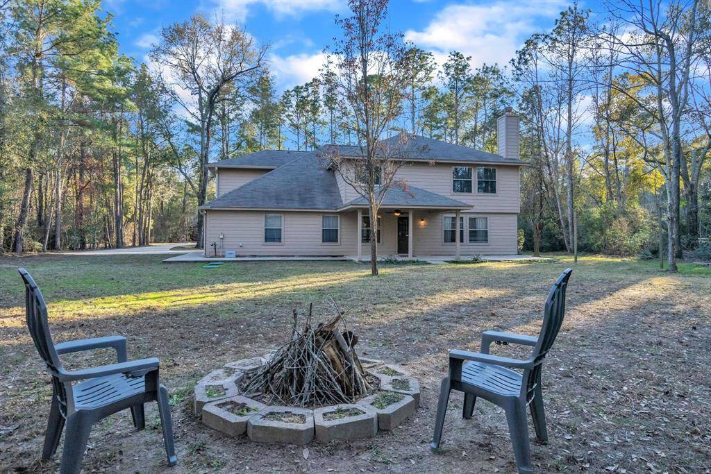 The spacious backyard has plenty of opportunities.  Build a pool, shop, RV storage, or an additional garage. This serene outdoor space is perfect for relaxation and entertaining.